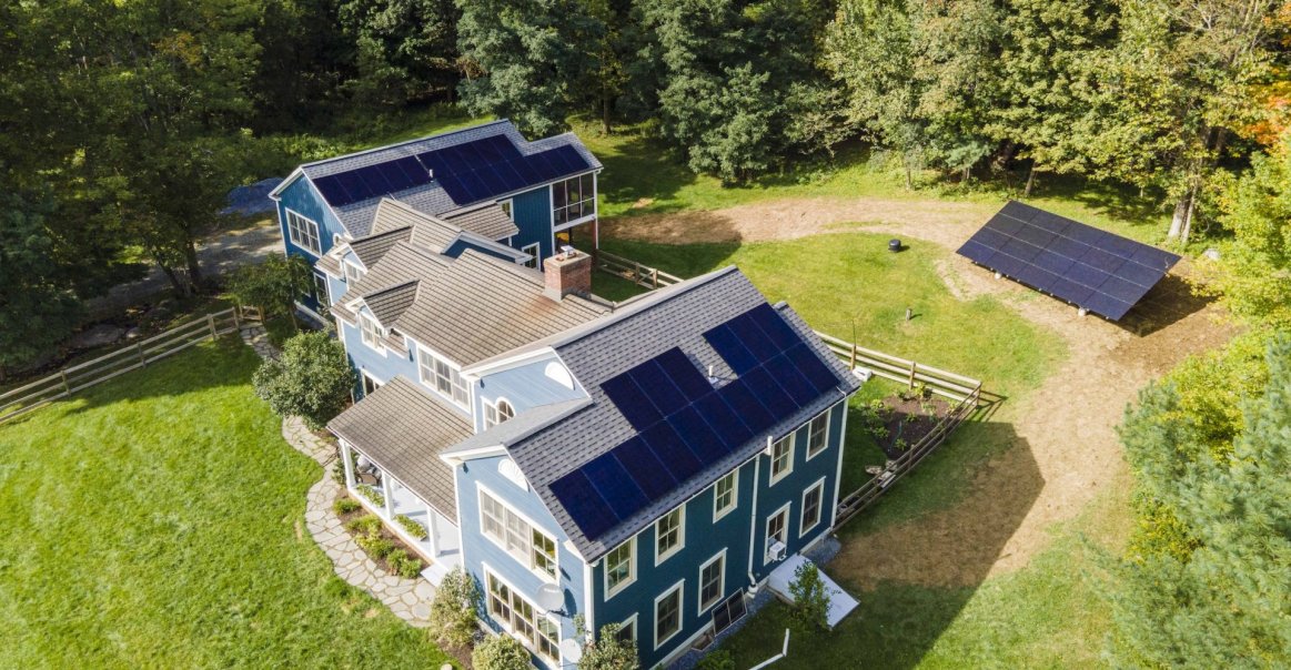 Residential roof mount and ground mount solar panel system in Vermont.